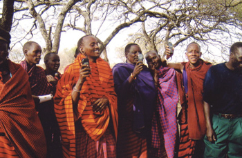 africa.com-Kenyan-men-wave-their-cell-phones